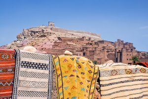 Ksar of Ait Ben Haddou with Berber carpets in the foreground
