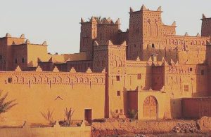 Decorated earthen kasbah with crenellated towers in the Ouarzazate region