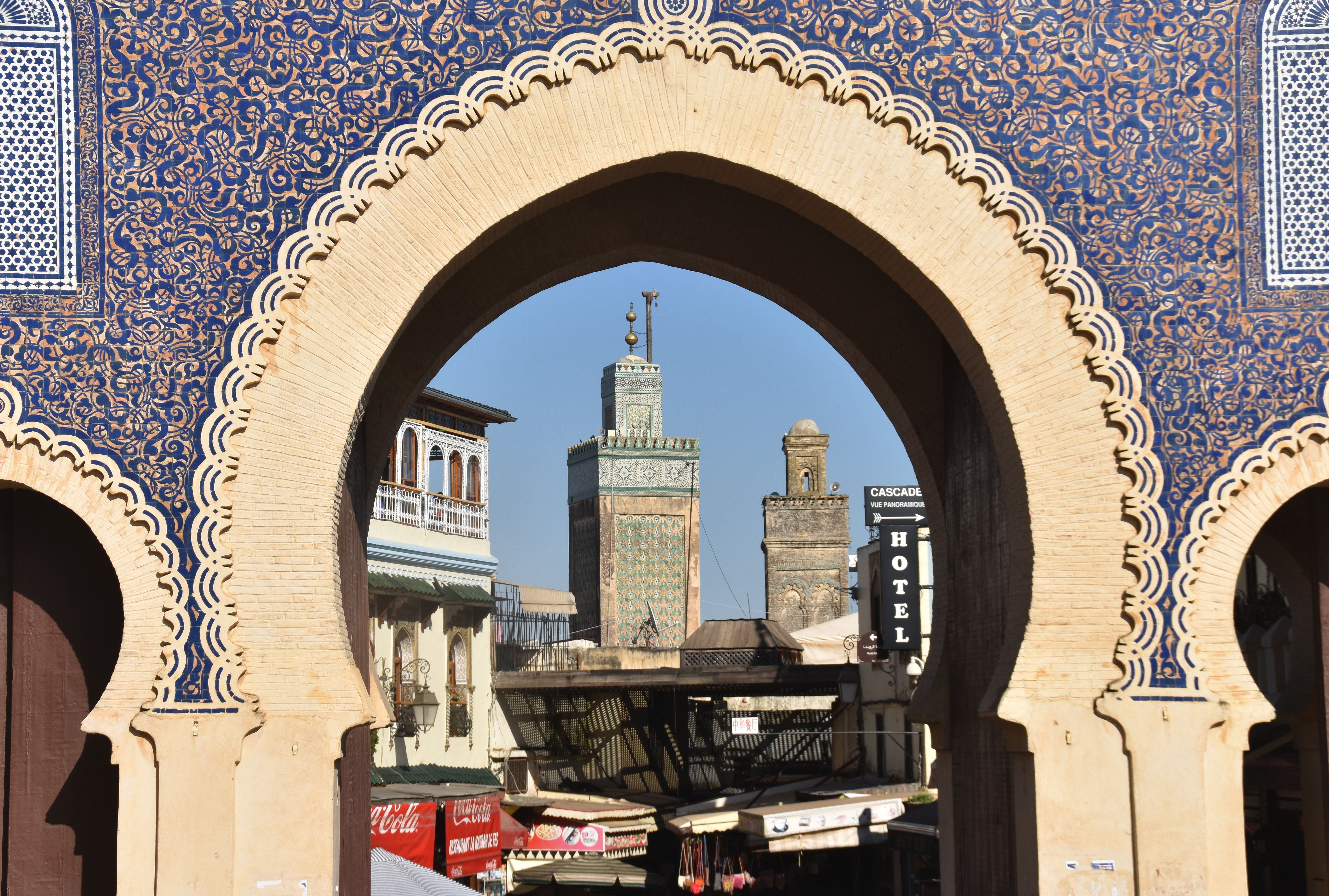Rooftops of the Fes Morocco medina at golden hour Coppersmith working in Place Seffarine, Fes