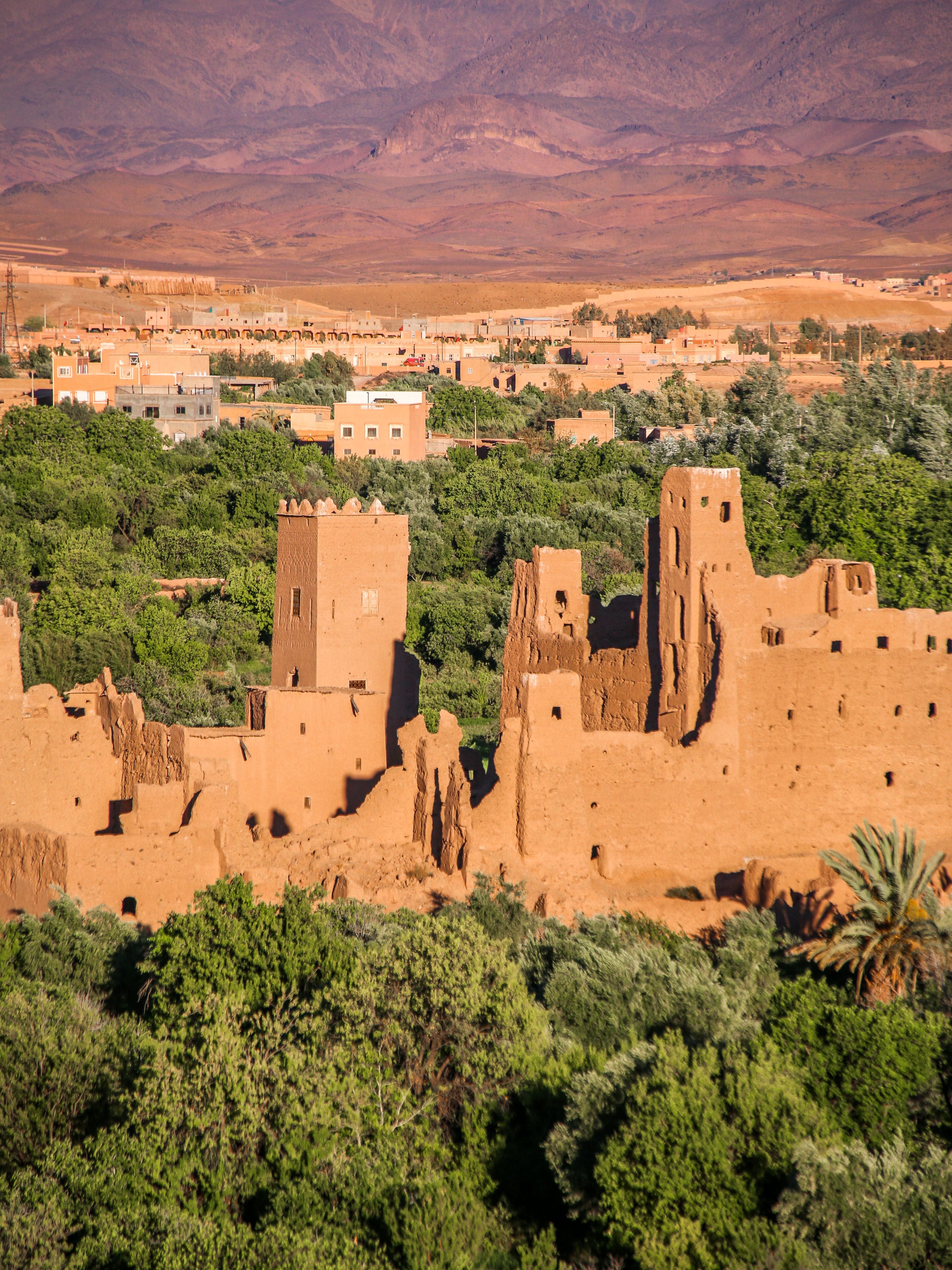 Traveller planning a trip to Morocco with a map of Marrakech and the Sahara